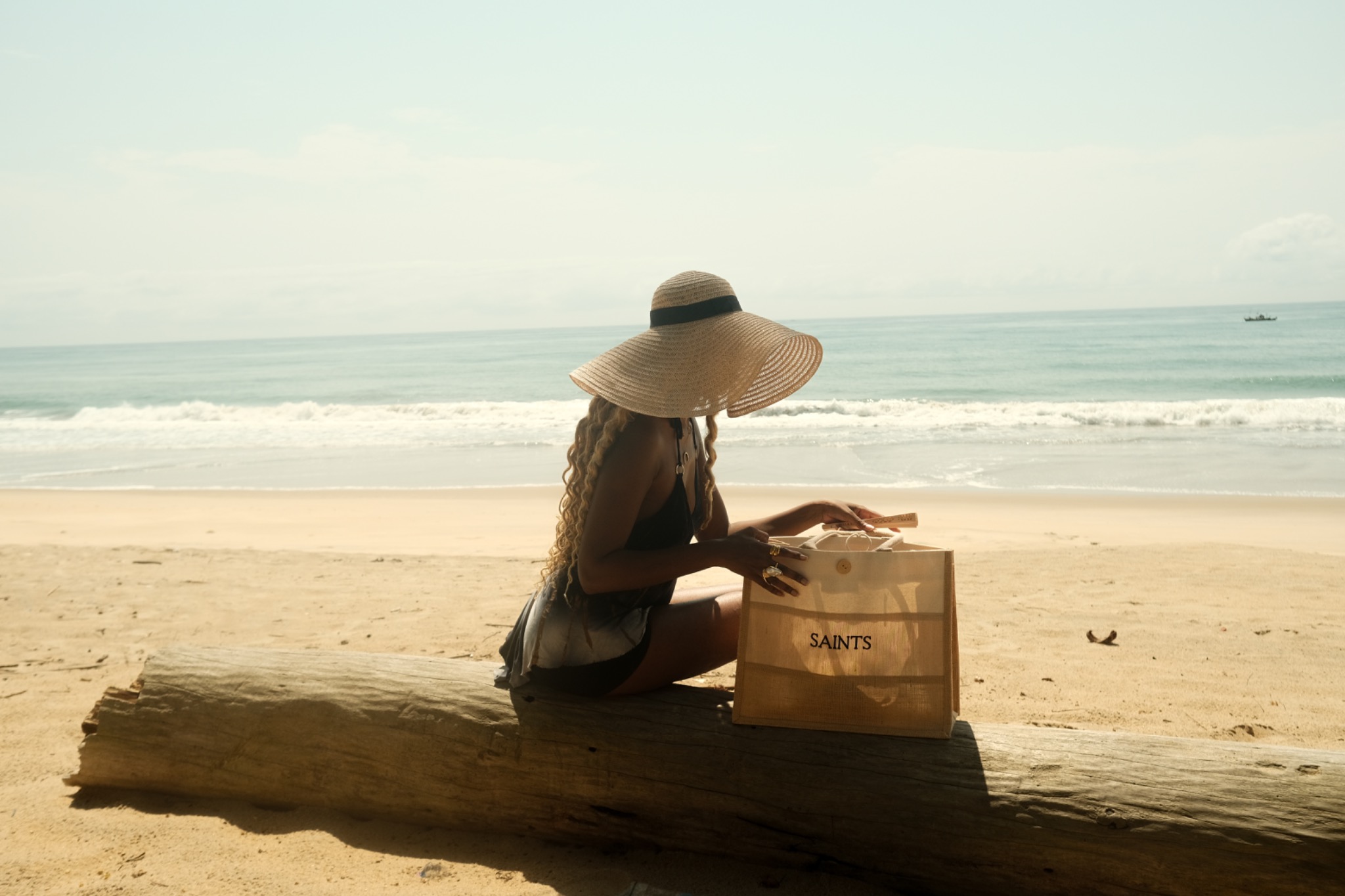 A guest enjoying a quiet moment beside the ocean at Yves & Saints